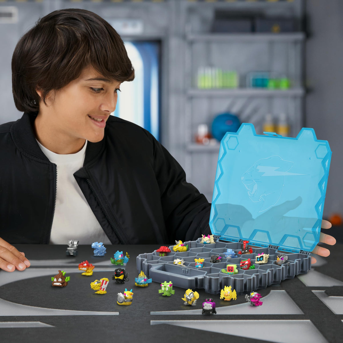 MrBeast Hive Collector Pack Holds 70+ Micro Beasts, with 26 Micro Beasts | Including 2 exclusive glow-in-the-dark swarms, 26 stickers and 2 fusion caps to continue to build out your own MrBeast lab